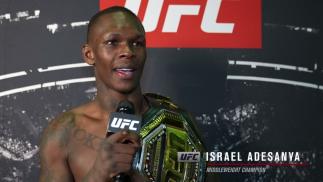 Israel Adesanya reacts with UFC.com after his unanimous decision victory over middleweight Marvin Vettori at UFC 263: Adesanya vs Vettori 2 on June 12, 2021