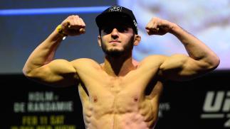 Islam Makhachev of Russia poses on the scale during the UFC 208 weigh-in inside Kings Theater on February 10, 2017 in Brooklyn, New York. (Photo by Jeff Bottari/Zuffa LLC/Zuffa LLC via Getty Images)