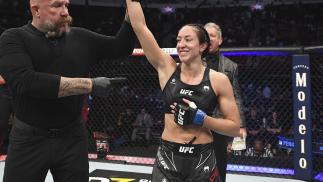 Jessica Penne reacts after submitting Karolina Kowalkiewicz of Poland in their women's strawweight bout during the UFC 265 event at Toyota Center on August 07 2021 in Houston Texas. (Photo by Josh Hedges/Zuffa LLC)