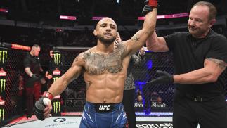 Miles Johns celebrates after defeating Anderson dos Santos of Brazil by knock out in their bantamweight bout during the UFC 265 event at Toyota Center on August 07 2021 in Houston Texas. (Photo by Josh Hedges/Zuffa LLC)