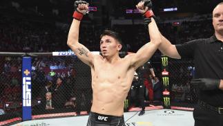 Vince Morales celebrates after defeating Drako Rodriguez in their bantamweight bout during the UFC 265 event at Toyota Center on August 07 2021 in Houston Texas. (Photo by Josh Hedges/Zuffa LLC)