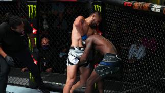 Saidyokub Kakhramonov of Uzbekistan secures a his third-round guillotine submission over Trevin Jones of Guam in their bantamweight bout at UFC Fight Night: Cannonier vs Gastelum on August 21 2021 in Las Vegas Nevada (Photo by Chris Unger/Zuffa LLC)