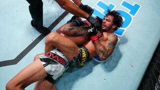 Alexandre Pantoja secures a rear-naked choke submission over Brandon Royval in their flyweight matchup at UFC Fight Night: Cannonier vs Gastelum on August 21 2021 in Las Vegas Nevada. (Photo by Chris Unger/Zuffa LLC)
