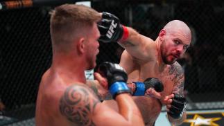 Parker Porter punches Chase Sherman in their heavyweight bout at UFC Fight Night: Cannonier vs Gastelum on August 21 2021 in Las Vegas. (Photo by Chris Unger/Zuffa LLC)