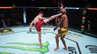 Ignacio Bahamondes Of Chile knocks out Roosevelt Roberts in their lightweight matchup at UFC Fight Night: Cannonier vs Gastelum on August 21 2021 in Las Vegas Nevada. (Photo by Chris Unger/Zuffa LLC)