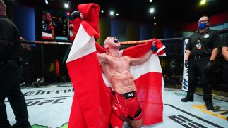 Mark O Madsen of Denmark reacts after his split decision victory over Clay Guida in their lightweight matchup at UFC Fight Night: Cannonier vs Gastelum on August 21 2021 in Las Vegas Nevada (Photo by Chris Unger/Zuffa LLC)