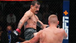 Vinc Pichel kicks Austin Hubbard in their lightweight matchup at UFC Fight Night: Cannonier vs Gastelum on August 21 2021 in Las Vegas Nevada (Photo by Chris Unger/Zuffa LLC)