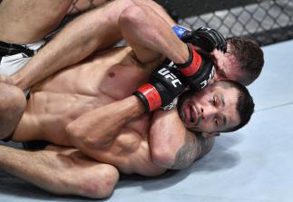 Gerald Meerschaert secures a rear choke submission against Makhmud Muradov of Tajikistan in a middleweight fight during the UFC Fight Night event at UFC APEX on August 28 2021 in Las Vegas Nevada. (Photo by Chris Unger/Zuffa LLC)
