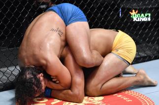Bryan Battle secures a rear choke submission against Gilbert Urbina in a middleweight fight during the UFC Fight Night event at UFC APEX on August 28 2021 in Las Vegas Nevada. (Photo by Chris Unger/Zuffa LLC)