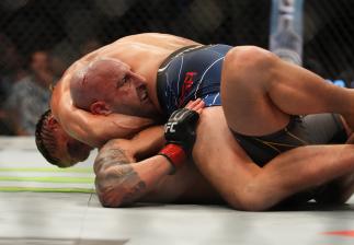 Alexander Volkanovski of Australia (Bottom) defends against Brian Ortega (Top) during the UFC 266 event on September 25, 2021 in Las Vegas, Nevada. (Photo by Cooper Neill/Zuffa LLC)