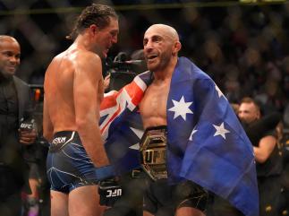 Brian Ortega and Alexander Volkanovski of Australia talk to each other following their bout during the UFC 266 event on September 25 2021 in Las Vegas Nevada. (Photo by Cooper Neill/Zuffa LLC)