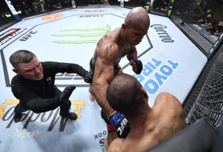 Gregory Rodrigues of Brazil punches Junyong Park of South Korea in a middleweight fight during the UFC Fight Night event at UFC APEX on October 23 2021 in Las Vegas Nevada. (Photo by Jeff Bottari/Zuffa LLC)