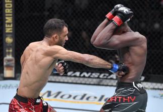 Jai Herbert of England punches Khama Worthy in a lightweight fight during the UFC Fight Night event at UFC APEX on October 23 2021 in Las Vegas Nevada. (Photo by Jeff Bottari/Zuffa LLC)