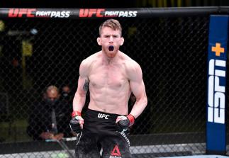 Cory Sandhagen reacts after his knockout victory over Frankie Edgar in their bantamweight fight during the UFC Fight Night event at UFC APEX on February 06 2021 in Las Vegas Nevada. (Photo by Chris Unger/Zuffa LLC)