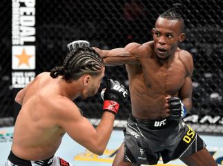 Ode Osbourne punches CJ Vergara in their flyweight fight during the UFC 268 event at Madison Square Garden on November 06, 2021 in New York City. (Photo by Jeff Bottari/Zuffa LLC)