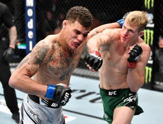 Ian Garry of Ireland punches Jordan Williams in their welterweight fight during the UFC 268 event at Madison Square Garden on November 06, 2021 in New York City. (Photo by Jeff Bottari/Zuffa LLC)