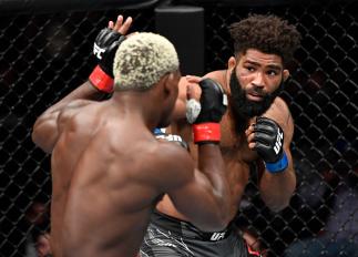 Chris Curtis punches Phil Hawes in their middleweight fight during the UFC 268 event at Madison Square Garden on November 06 2021 in New York City. (Photo by Jeff Bottari/Zuffa LLC)