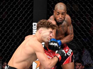 Bobby Green punches Al Iaquinta in their lightweight fight during the UFC 268 event at Madison Square Garden on November 06 2021 in New York City. (Photo by Jeff Bottari/Zuffa LLC)