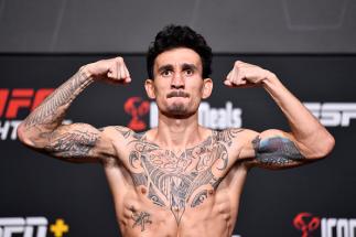 Max Holloway poses on the scale during the UFC Fight Night weigh-in at UFC APEX on November 12, 2021 in Las Vegas, Nevada. (Photo by Chris Unger/Zuffa LLC)