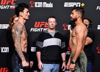 Opponents Max Holloway and Yair Rodriguez of Mexico face off during the UFC Fight Night weigh-in at UFC APEX on November 12, 2021 in Las Vegas, Nevada. (Photo by Chris Unger/Zuffa LLC)