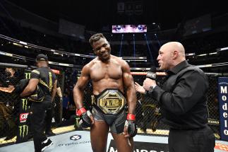 UFC Heavyweight Champion Francis Ngannou of Cameroon Reacts With Joe Rogan After His Unanimous Decision Victory Over Ciryl Gane Of France At UFC 270: Ngannou vs Gane. (Photo by Chris Unger/Zuffa LLC)
