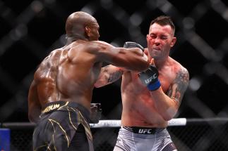 Colby Covington punches Kamaru Usman in their welterweight title bout during the UFC 268 event at Madison Square Garden on November 06, 2021 in New York City. (Photo by Mike Stobe/Getty Images)