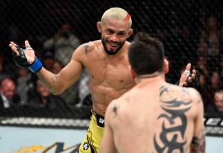 Deiveson Figueiredo of Brazil battles Brandon Moreno of Mexico in their UFC flyweight championship fight during the UFC 270 event at Honda Center on January 22, 2022 in Anaheim, California. (Photo by Chris Unger/Zuffa LLC)