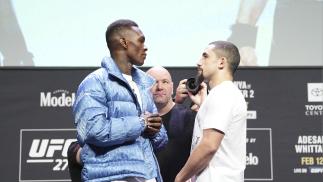 Israel Adesanya of Nigeria and Robert Whittaker of Australia face off during the UFC 271 press conference at George R. Brown Convention Center on February 10, 2022 in Houston, Texas. (Photo by Josh Hedges/Zuffa LLC)