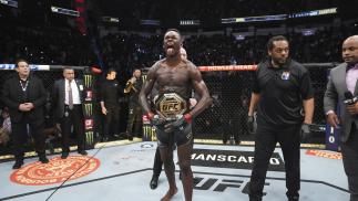 Israel Adesanya of Nigeria celebrates defeating Robert Whittaker by Unanimous Decision at UFC 271: Adesanya vs Whitakker 2
