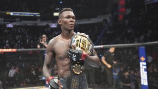 Israel Adesanya of Nigeria reacts to his Unanimous Decision win over Robert Whittaker at UFC 271: Adesanya vs Whittaker 2