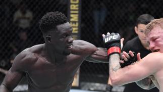 David Onama of Uganda punches Mason Jones of Wales in a lightweight fight during the UFC Fight Night event at UFC APEX on October 23, 2021 in Las Vegas, Nevada. (Photo by Jeff Bottari/Zuffa LLC)