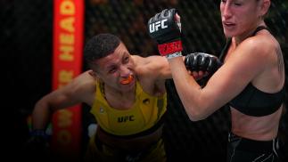 Josiane Nunes of Brazil punches Bea Malecki of Sweden in a bantamweight fight during the UFC Fight Night event at UFC APEX on August 21, 2021 in Las Vegas, Nevada. (Photo by Chris Unger/Zuffa LLC)