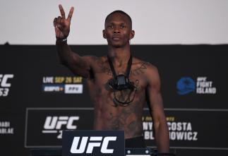 Israel Adesanya of Nigeria poses on the scale during the UFC 253 weigh-in on September 25, 2020 at Flash Forum on UFC Fight Island, Abu Dhabi, United Arab Emirates. (Photo by Josh Hedges/Zuffa LLC via Getty Images)