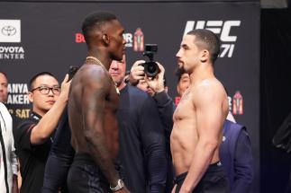 Israel Adesanya of Nigeria and Robert Whittaker of Australia face off during the UFC 271 ceremonial weigh-in at Toyota Center on February 11, 2022 in Houston, Texas. (Photo by Josh Hedges/Zuffa LLC)