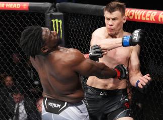 Maxim Grishin of Russia punches William Knight in their heavyweight fight during the UFC 271 event at Toyota Center on February 12, 2022 in Houston, Texas. (Photo by Josh Hedges/Zuffa LLC)