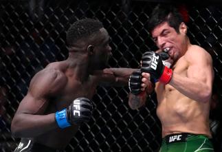 David Onama of Uganda drops Gabriel Benitez of Mexico with a punch in their featherweight fight during the UFC Fight Night event at UFC APEX on February 19, 2022 in Las Vegas, Nevada. (Photo by Jeff Bottari/Zuffa LLC)