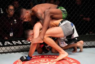 Terrance McKinney battles Fares Ziam of France in their lightweight fight during the UFC Fight Night event at UFC APEX on February 26, 2022 in Las Vegas, Nevada. (Photo by Chris Unger/Zuffa LLC)