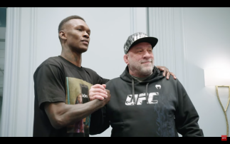 Israel Adesanya poses for photo during UFC 271: Adesanya vs Whittaker 2 fight week