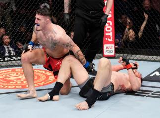 Tom Aspinall of England celebrates his submission victory over Alexander Volkov of Russia in a heavyweight fight during the UFC Fight Night event at O2 Arena on March 19, 2022 in London, England. (Photo by Chris Unger/Zuffa LLC)