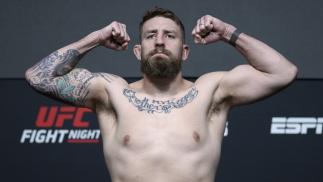 Chris Daukaus poses on the scale during the UFC Fight Night weigh-in at UFC APEX on December 17, 2021 in Las Vegas, Nevada. (Photo by Jeff Bottari/Zuffa LLC)