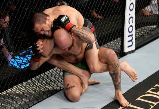 Umar Nurmagomedov of Russia secures a rear choke against Brian Kelleher in their featherweight fight during the UFC 272 event on March 05, 2022 in Las Vegas, Nevada. (Photo by Jeff Bottari/Zuffa LLC)