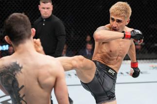 Luis Saldana kicks Bruno Souza of Brazil in a featherweight fight during the UFC Fight Night event at Nationwide Arena on March 26, 2022 in Columbus, Ohio. (Photo by Josh Hedges/Zuffa LLC)