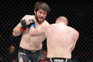 Aliaskhab Khizriev of Russia punches Denis Tiuliulin of Russia in a middleweight fight during the UFC Fight Night event at Nationwide Arena on March 26, 2022 in Columbus, Ohio. (Photo by Josh Hedges/Zuffa LLC)
