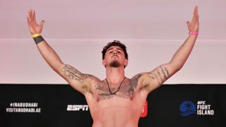 Tom Aspinall of England poses on the scale during the UFC Fight Night weigh-in inside Flash Forum on UFC Fight Island on July 24, 2020 in Yas Island, Abu Dhabi, United Arab Emirates. (Photo by Jeff Bottari/Zuffa LLC)