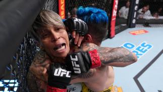 Jessica Andrade executes the first standing arm triangle submission in UFC history on Amanda Lemos, 4/23/22 in Las Vegas, NV. (Photo by Jeff Bottari/Zuffa LLC)