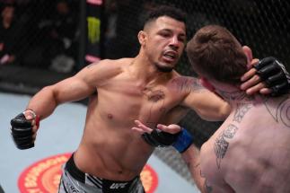 Drakkar Klose punches Brandon Jenkins in their lightweight fight during the UFC Fight Night event at UFC APEX on April 16, 2022 in Las Vegas, Nevada. (Photo by Jeff Bottari/Zuffa LLC)