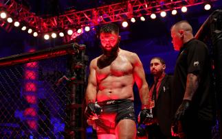 Andrei Arlovski of Belarus exits the octagon after winning his heavyweight fight against Jared Vanderaa via split decision during UFC 271 at Toyota Center on February 12, 2022 in Houston, Texas. (Photo by Carmen Mandato/Getty Images)
