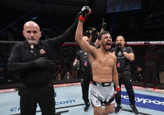 Julio Arce reacts after his unanimous-decision victory over Daniel Santos of Brazil in their bantamweight fight during the UFC 273 event at VyStar Veterans Memorial Arena on April 09, 2022 in Jacksonville, Florida. (Photo by Jeff Bottari/Zuffa LLC)