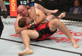Aleksei Oleinik of Russia secures a submission against Jared Vanderaa in their heavyweight fight during the UFC 273 event at VyStar Veterans Memorial Arena on April 09, 2022 in Jacksonville, Florida. (Photo by Jeff Bottari/Zuffa LLC)