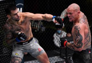 Aleksandar Rakic punches Anthony Smith in their light heavyweight bout inside the UFC APEX.
